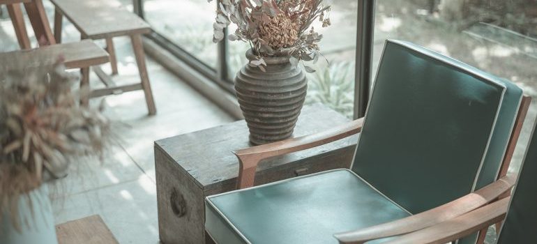 An armchair and a vase. 