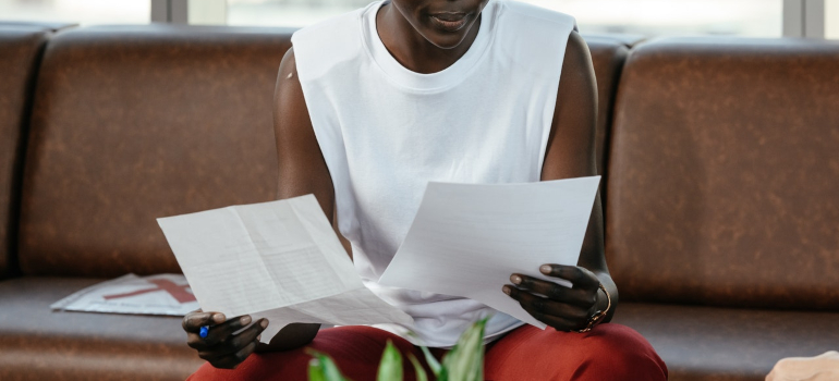 a person reading 2 papers 