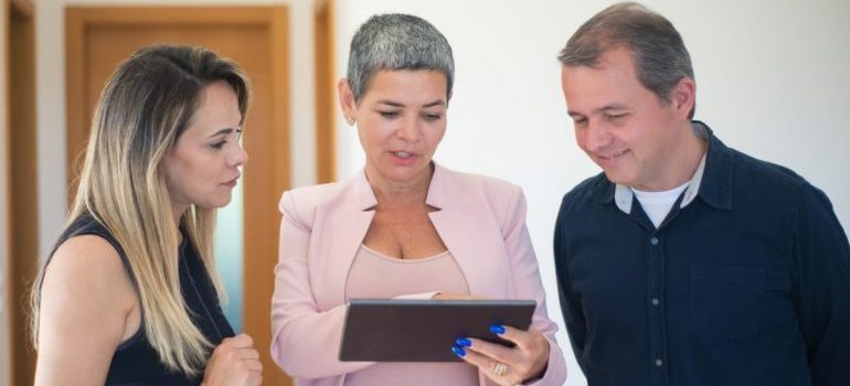 A couple with a real estate agent