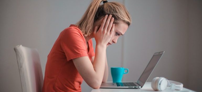 woman frustrated in front of a laptop